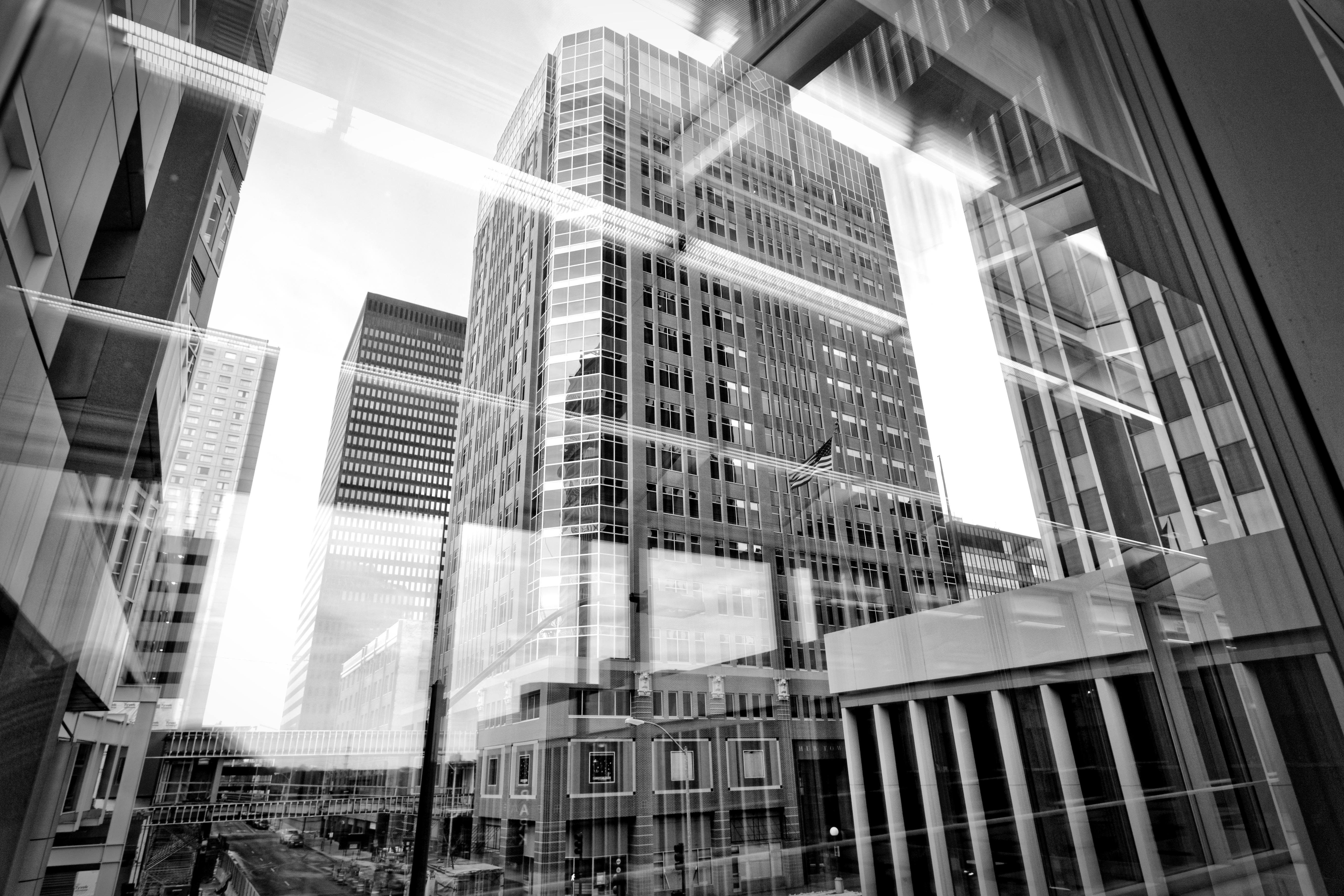 Layered architectural reflections through skywalk glass