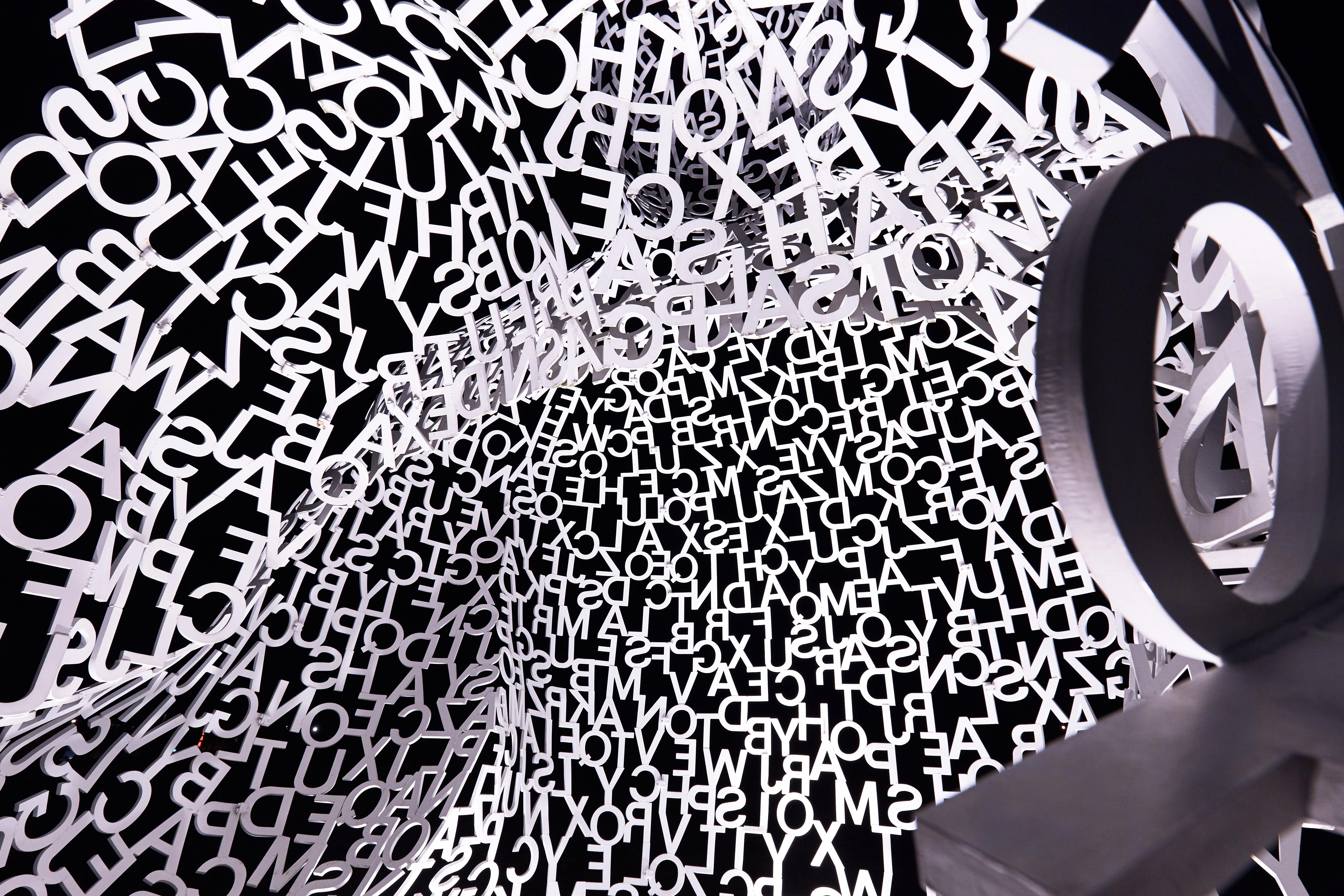 Jaume Plensa's Nomade sculpture in contemplative pose